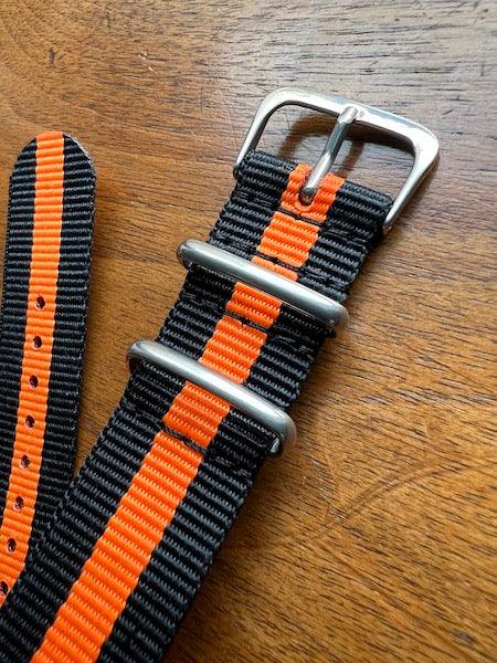 Bracelet NATO en nylon balistique noir et orange